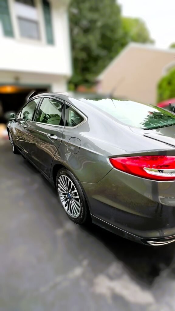 mobile exterior detail of grey sedan glossy paint